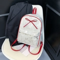 Polka dot backpack with large red bow and red straps on a minimalist chair - White Butterfly Texture Style (No Pendant)