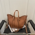 Caramel brown pebbled leather tote bag with white contrast stitching and shoulder strap - Brown
