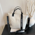 Minimalist canvas tote lunch bag with dual handles and shoulder strap in off-white - White