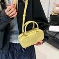 Chic lemon yellow PVC jelly pillow bag with top handles and adjustable shoulder strap - Yellow