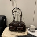 Dark brown patent leather baguette bag with dual front pockets and silver zippers - Brown