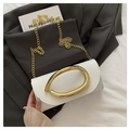 White rectangle crossbody bag with gold buckle and chain strap on grey suit background - White