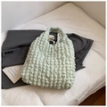 Detailed view of mint green bubble texture on a large capacity pleated tote bag - Green