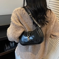 Chic black glossy semi-moon Hobo bag for women featuring an adjustable metal buckle strap - Black