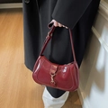 Glossy burgundy baguette shoulder bag with adjustable strap and gold metal buckle - Burgundy