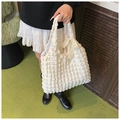 White puffy pleated tote bag with a beige lace bow accent on the side for women - White