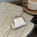 Mini cream leather jewelry pouch with gold kiss-lock closure for rings and small items - White