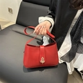 Classic red shoulder bag in matte leather featuring a gold gourd-shaped clasp lock - Red