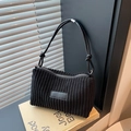Minimalist black corduroy underarm bag with sleek leather strap and knot detail - Black