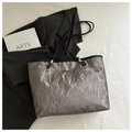 Detail of silver metallic crinkled tote bag texture with slim black handle and logo - Grey (Without Pendant)