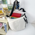 White nylon crescent crossbody bag with adjustable black strap and minimalist design - White