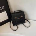 Petit sac à dos rétro en cuir PU noir pour femme avec boucle dorée et poignée supérieure - Noir