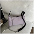 Close-up of light purple nylon shoulder bag with silver chain and black strap details - Purple