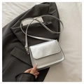 Silver metallic crossbody bag featuring embossed cartoon bears and a slim shoulder strap - Silver
