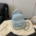 Chic light blue mini chain backpack featuring a sweet leather bow and lace detailing - Blue