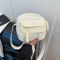 Retro cream corduroy crossbody bag featuring a front pocket and woven zipper pull detail - White