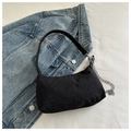 Minimalist black nylon hobo bag with silver chain strap and crescent shape detail - Black