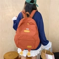 Cartoon duck backpack in warm orange-brown with cute 3D feet for school students - Orange