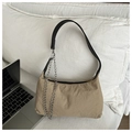 Detail of khaki nylon crescent bag with silver chain and laptop in casual setting - Khaki