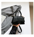 Elegant black quilted handbag with gold hardware and top handle for women's daily use - Black