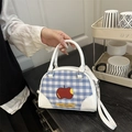 Blue and white plaid handbag featuring apple graphics and white leather trim detailing - White