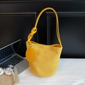 Minimalist yellow suede shoulder bucket bag with stylish knot strap and round charm - Yellow