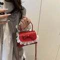 Mini red crossbody bag with sweet bow design and white lace trim detail - Red