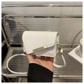 Detail of white cherry print handbag with golden metal trim and sleek PU leather texture - White
