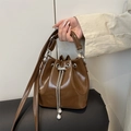 Brown oil wax leather bucket bag with silver chain drawstring and pearl accents - Brown
