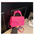 Detail view of hot pink quilted square bag with pleated handle and metal buckle - Rose Red