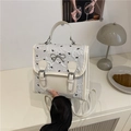 Zaino bianco crema con motivo a fiocchi neri e dettaglio metallico in argento - Bianco Senza Pendente