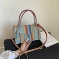 Colorful striped woven shoulder bag with hollow design for beach vacations and daily use - Blue