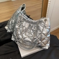 Silver quilted bucket bag with star motif and metallic chain strap in a modern design - Silver