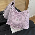 Pink quilted bucket bag with glossy patent finish and sparkling star emblem - Purple