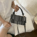 Striped woven crossbody bag with black white grey pattern and unique knot handle - Black