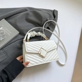 White quilted crossbody bag with soft gathered handle and golden geometric metal lock - White