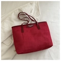 Detailed close-up of dark red suede tote bag texture with FANYISSA BAGS brand label - Burgundy