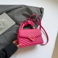 Quilted rose red crossbody bag with V-shaped stitching and pleated top handle detail - Rose Red