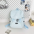Detail of light blue nylon hiking backpack with side pocket on a white pegboard background - Large Blue No Charm