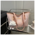 Detail of pink embossed tote bag with rainbow wavy stitching and fluffy cloud charm - Pink With Pendant