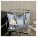 Detail of light blue striped tote bag with rainbow wavy embroidery and cloud plush charm - Blue With Charm