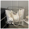 Detail of canvas tote bag featuring colorful wavy embroidery and a cloud plush charm - White With Pendant
