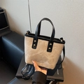 Schicke Beige Segeltuch Beuteltasche mit schwarzem Lederbesatz und Tragegriff - Reis Canvas Schwarz Splicing