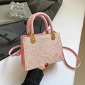 Pink crossbody handbag for women featuring floral embroidery and woven top handle - Pink