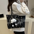 Black canvas tote bag with colorful embroidery and white cloud plush charm detail - Black With Cloud Pendant