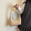 Beige patent leather hobo bag with a high-gloss finish and silver hardware accents - Khaki