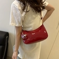 Chic red crescent hobo bag in patent leather with a cherry charm on model - Red (With Cherry Charm)