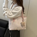 Pink embroidered tote bag with stylish wave patterns and cute plush bear charm accessory - Pink With Charm