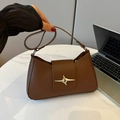Brown minimalist shoulder bag featuring a silver star metal buckle and adjustable strap - Brown