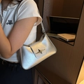Minimalist silver metallic underarm bag with star buckle and sleek liquid sheen finish - Silver